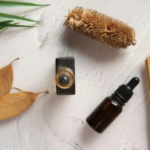 Home Flat lay of aromatherapy oils and natural elements on a textured surface. Perfect for wellness themes.