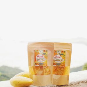 Home Tropical scenery showcasing packaged dried mangoes and fresh mangoes.